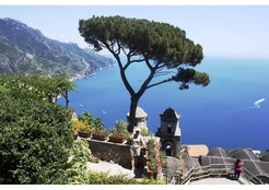 Tourists taking pictures against the backdrop of the Amalfi Coast landscape from the Villa Rufolo, Ravello (SA), Italy.